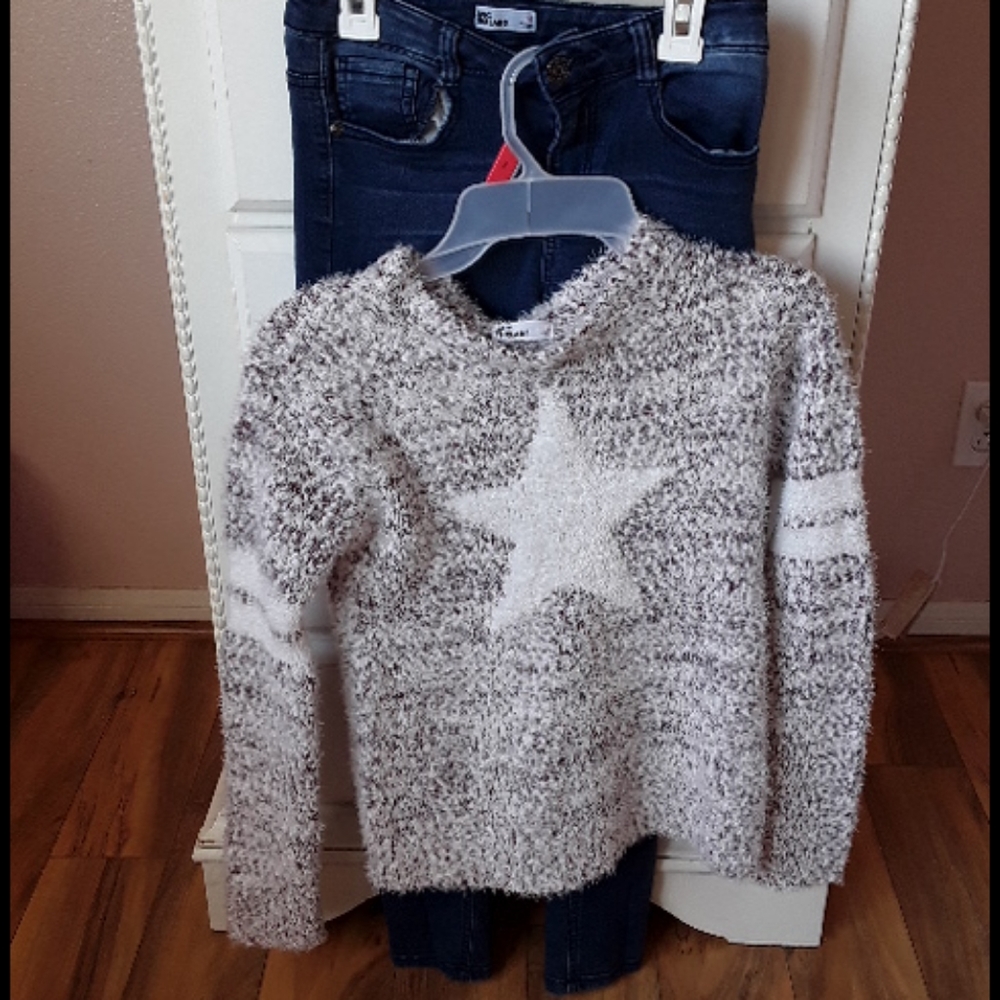 A sweater with dark jeans
